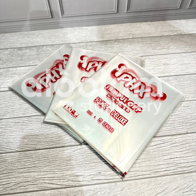 

SATU PACK ( 50 LEMBAR ) Sampul Plastik OPP Buku Tulis Kwarto Sampul Plastik Buku Tulis Qwarto lengkap