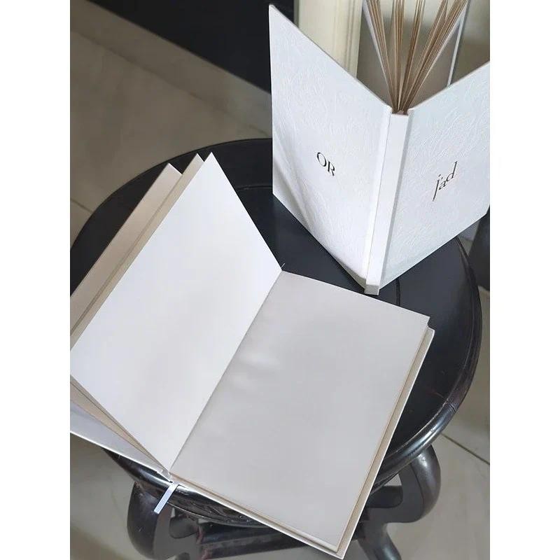 

This stylish and exquisite white embossed printed d notebook features a high-quality appearance with gold edges on both sides