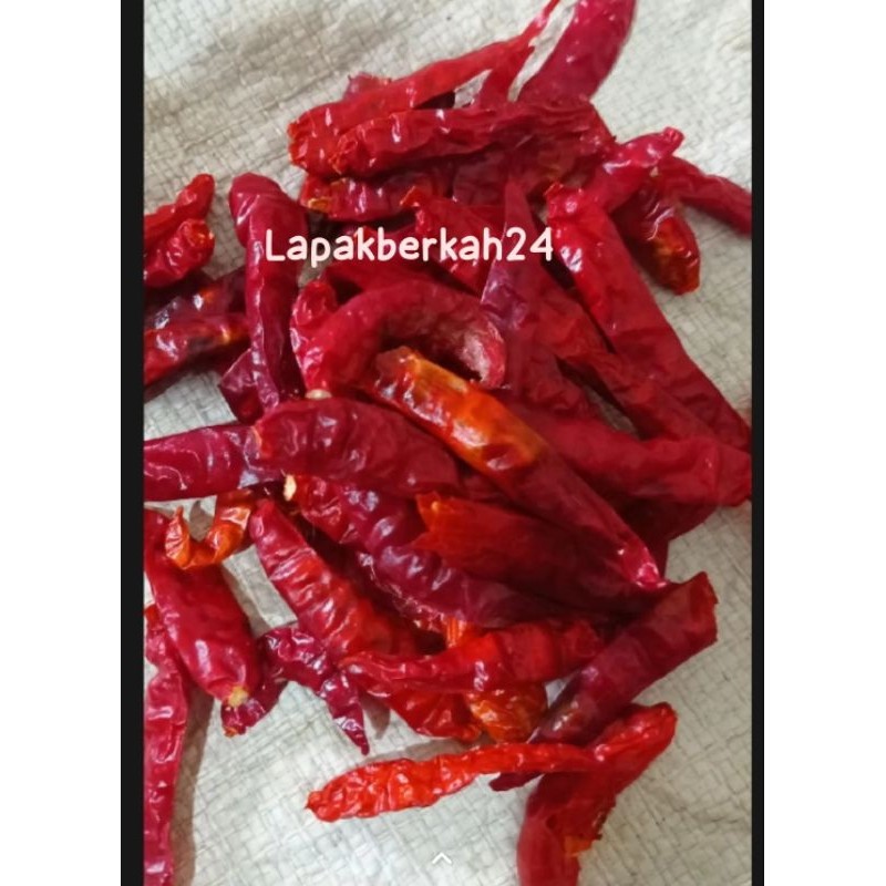 

Paket kemasan ( 1.kg ) CABE RAWIT TEJA CAPLAK KERING KUALITAS SUPER PEDAS tanpa tangkai