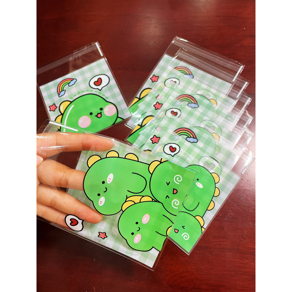 

100pcs Green Dinosaur Graffiti Gift Packaging OPP Self-Sealing Bag, Green Grid Heart Rainbow Pattern Gift Card Decor OPP Bags