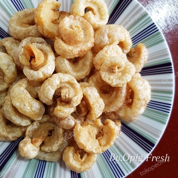 

BEST SELLER kerupuk kulit babi/krubi/kerupuk kulit babi sam can opig 100gr - Asin