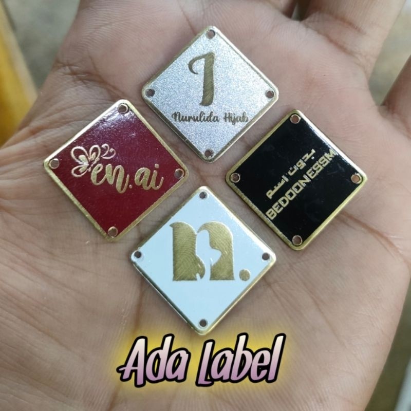 

costum label hijab/label plat besi stenlis kuningan