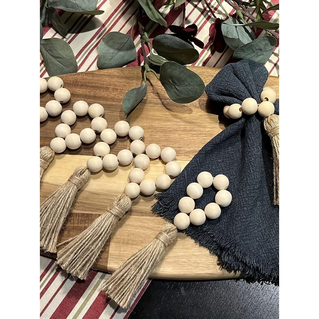 

1 set of 6 wooden beads, hemp rope tassels, napkin ring buckles