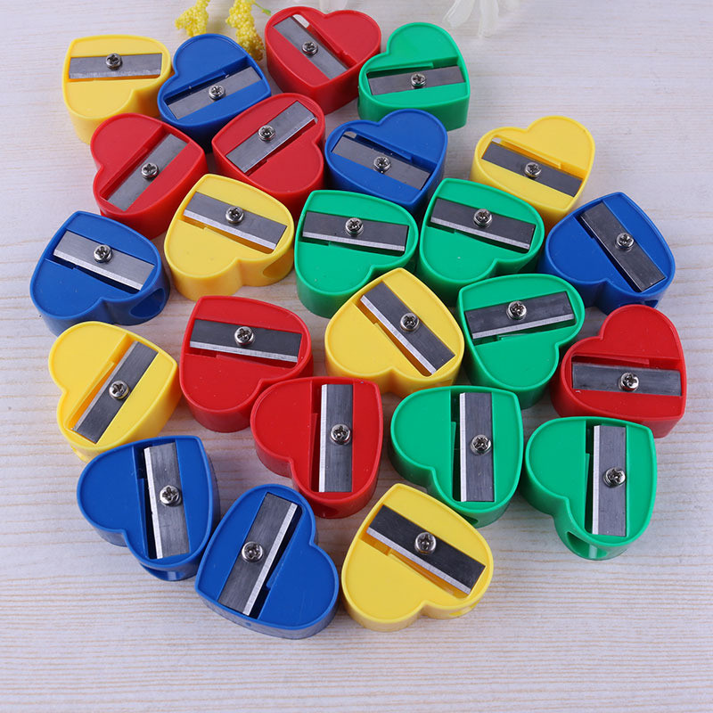

100pcs/lot Mini Heart-shaped Pencil Sharpener Candy Color Standard Pencil Cutting Ma ine Student S ool Stationery wholesale
