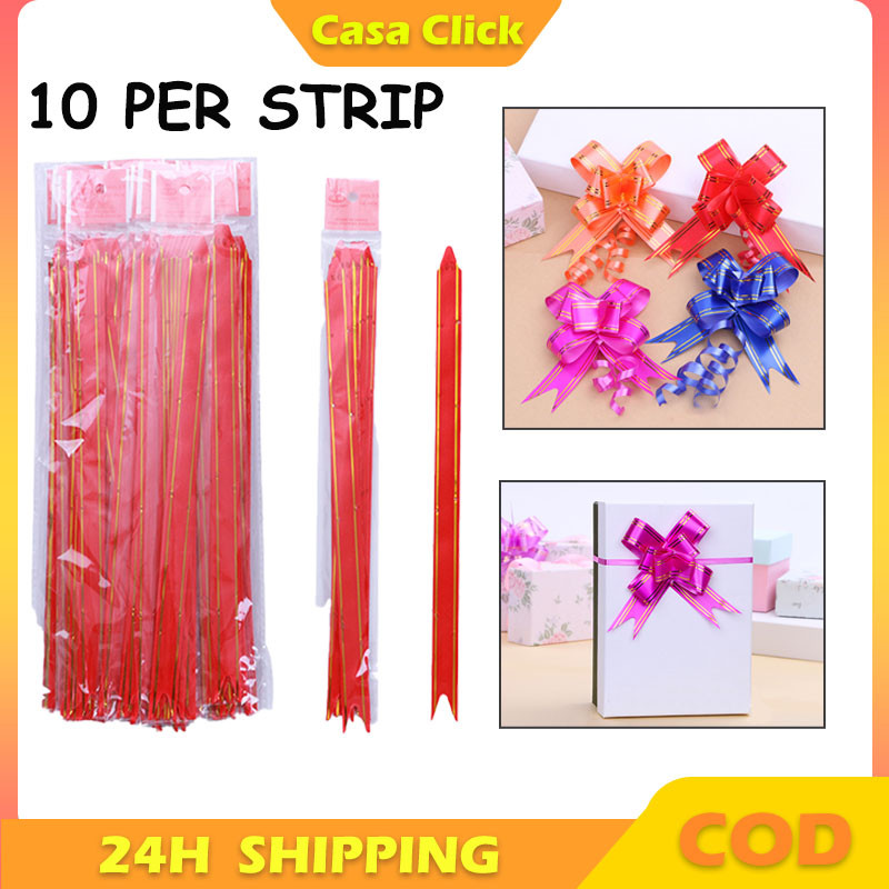 

Pita Tarik 10cm LIS EMAS Souvenir Pull Flower Ribbon Gold Stripes Isi 10Pcs