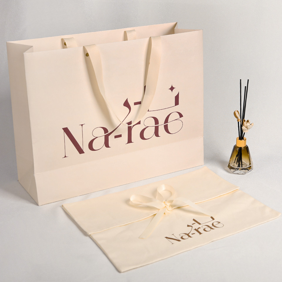 

Custom Recycled Luxury Cream Beige Shopping Paper Bags With Your Own Logo Ivory Clothes Packaging Gift Bag With Ribbon Handle