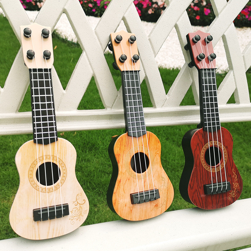 

1Pc 25cm Ukulele Toys Children's Small Guitar Model Musical Enlightenment Music Instrument Toy Mini 4-String Guitar