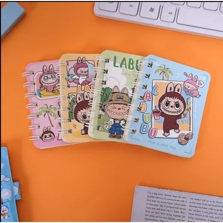 

Note Book Mini Buku Catatan Spiral Labubu A7 BK-1666 / Tersedia 4 Warna / Buku Mini Bergaris Bisa COD Grosir