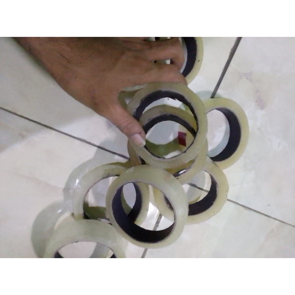 

Lakban bijian Bening Isolasi 1/2 0,5 inch inci 12MM 12 MM 50 60 72 90 100 yard OPP Plakban ATK Tape Perekat Kuat Solatip cod