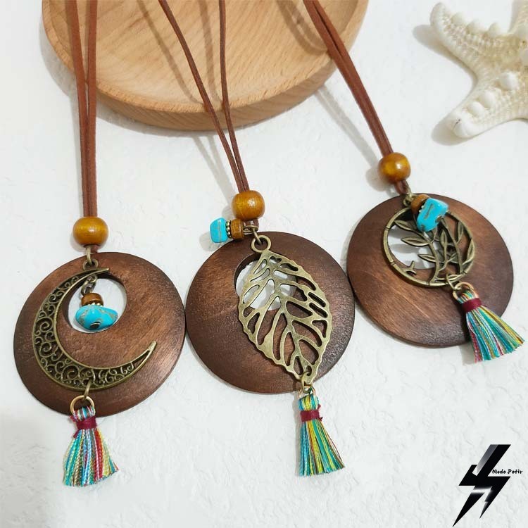 Liontin berumbai retro etnik Bohemian daun bulat berlubang aksesoris serbaguna panjang kalung wanita