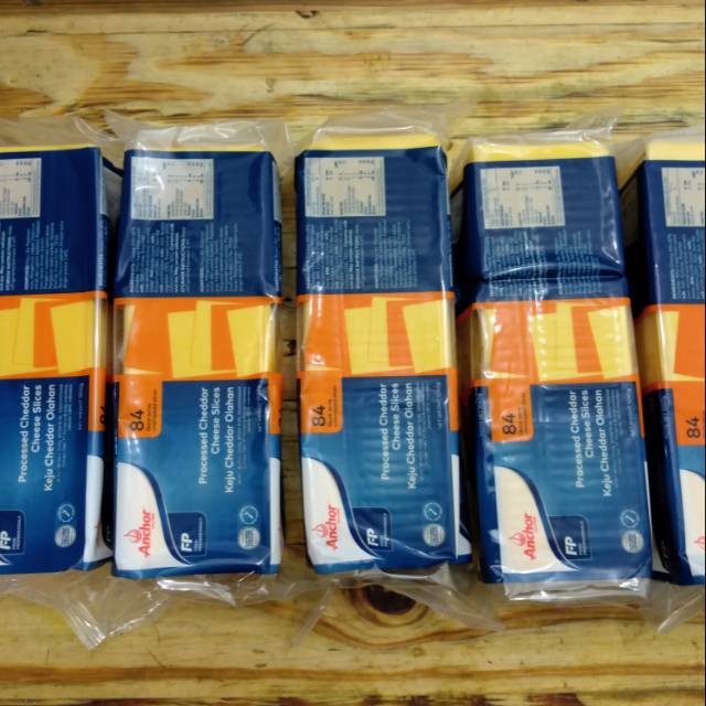 

Anchor Orange Cheddar Slice / Keju Slice Anchor (1KG -84 Slices) Keju Slice Anchor -Orange