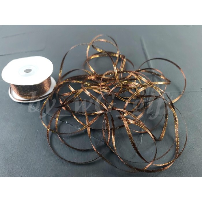 

Pita Satin List Emas; Lebar 1/8 Inch ( 3 mm); Panjang 80 yard - HL 32