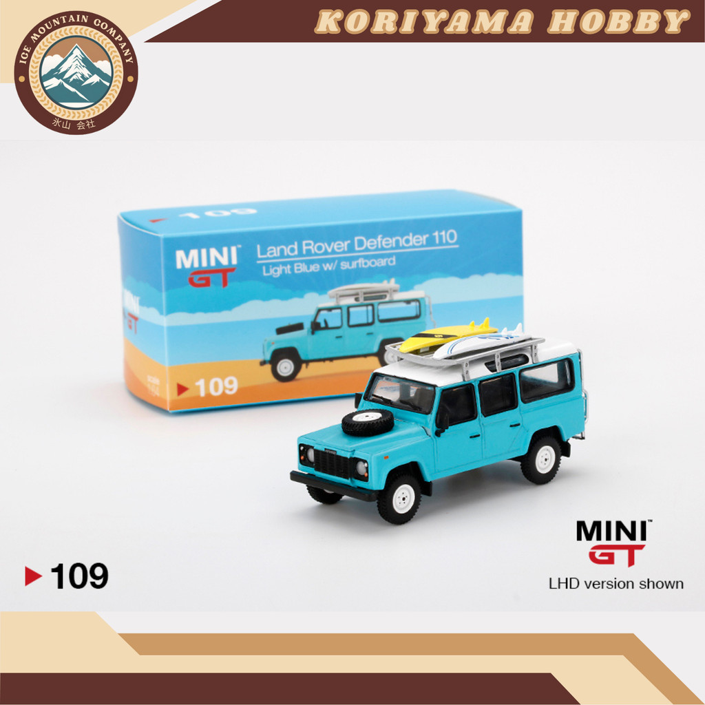 Mini GT 109 Land Rover Defender 110 Light Blue W/ Surfboard MiniGT