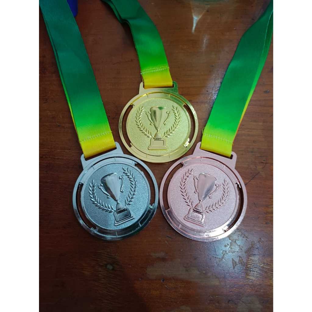 MEDALI LOGAM IMPORT GELAS CHAMPIONS MEDALI BOLA FUTSAL VOLLY BADMINTON DLL SATUAN