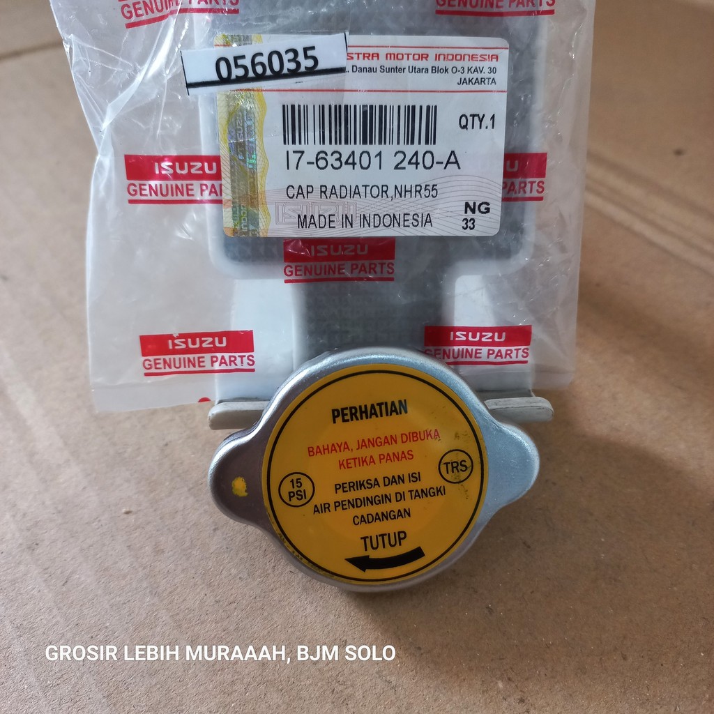 TUTUP RADIATOR I7-63401 240-A ELF NHR NKR 55 / NKR71 ISUZU GENUINE
