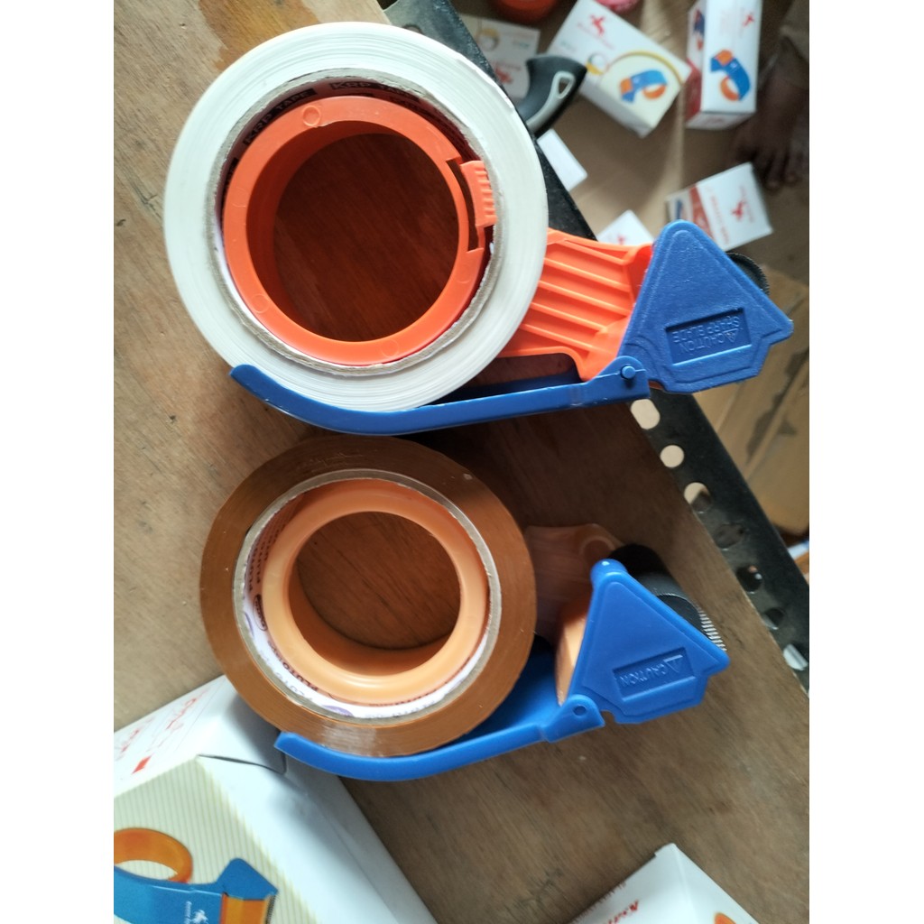 

tape cutter tape dispenser rolan rollan lakban lebar 2 inch bisa untuk panjang sampai 300 yard memudahkan pekerjaan paking barang praktis dan ekonomis