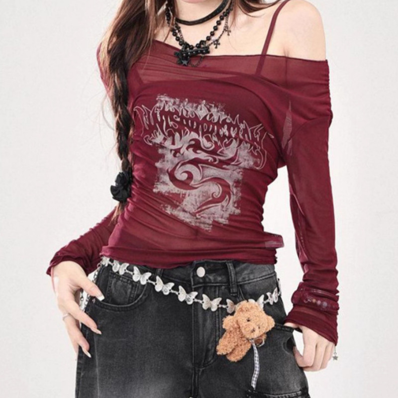 Cute Hot Label Atasan crop top jala transparan lengan panjang dengan model bahu terbuka.
