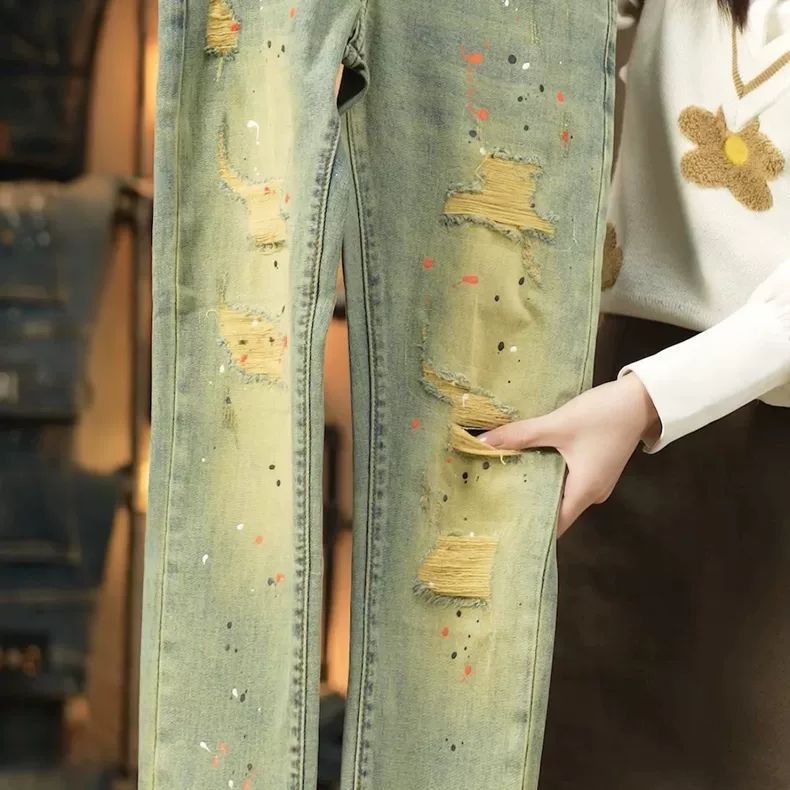 Celana sembilan titik celana pria Amerika ripped painted jeans slim fit