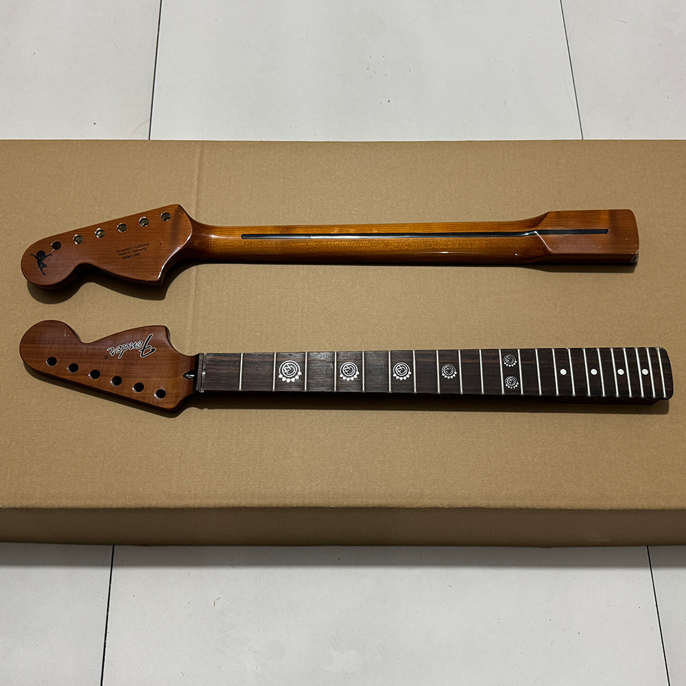 Charred maple guitar head, rosewood fingerboard, custom inlay