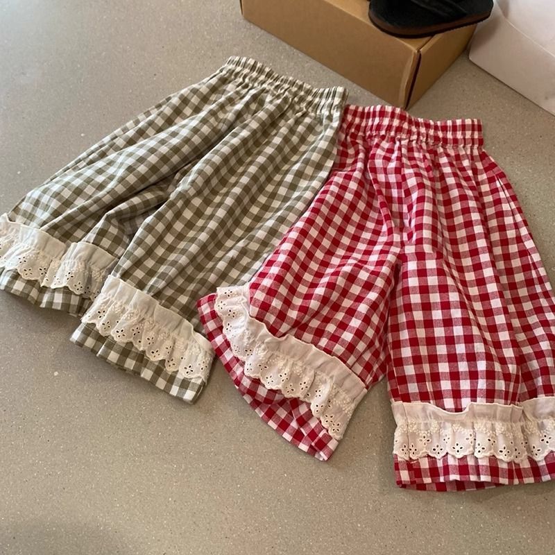 Pakaian anak perempuan gaya Korea, celana longgar motif kotak-kotak renda retro.