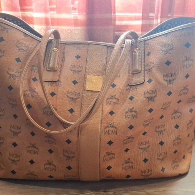 MCM Liz Reversible Shopper Tote Bag in Cognac Visetos coated canvas.