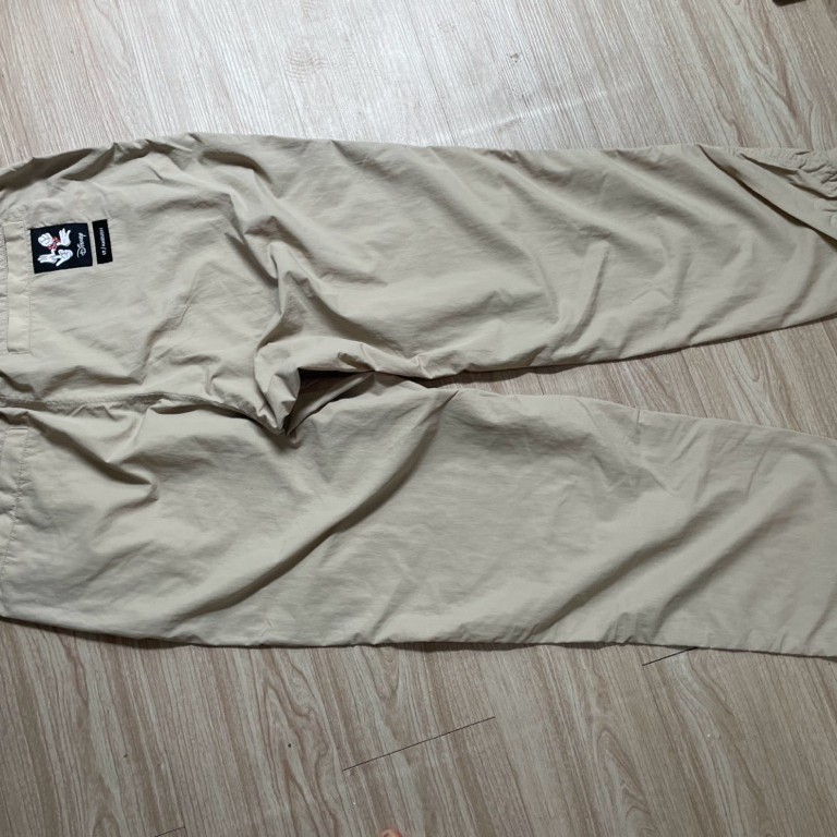 celana panjang merk uniqlo X disney ambush