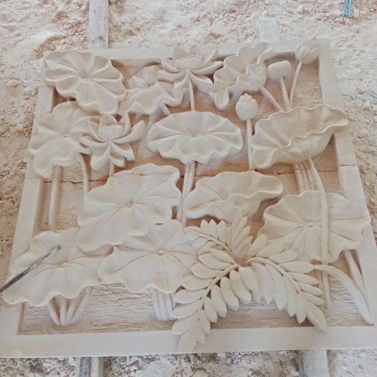 relief ukir batu alam bunga lotus