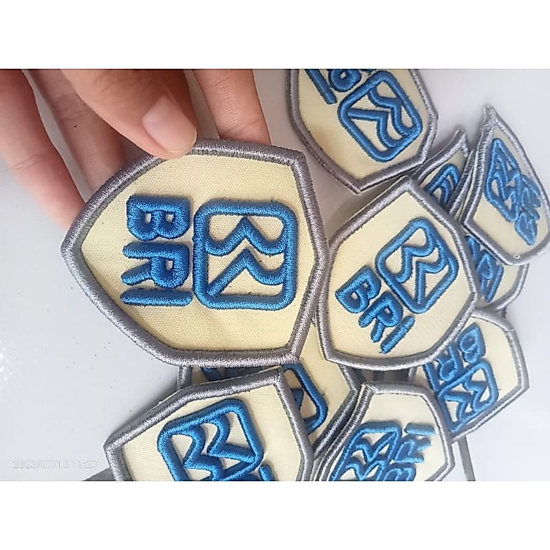 BORDIR LOGO BRI BARU BRI KREM/NAMTAG SATPAM BRI KREM
