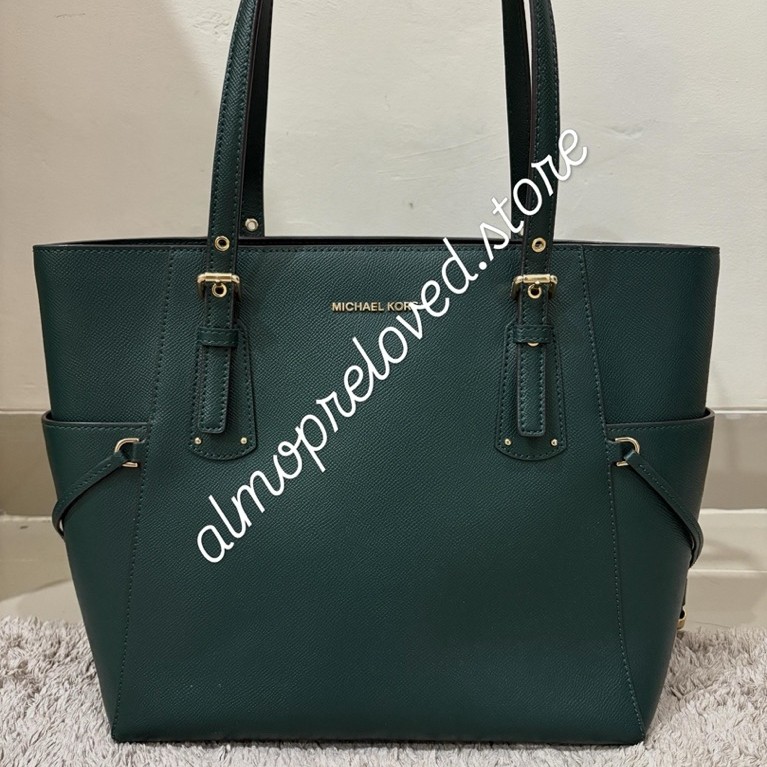 Preloved MK green voyager tote