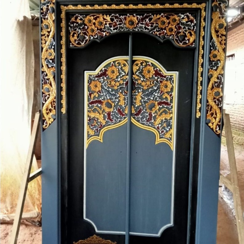 pintu ukir kupu tarung kayu jati model terbaru