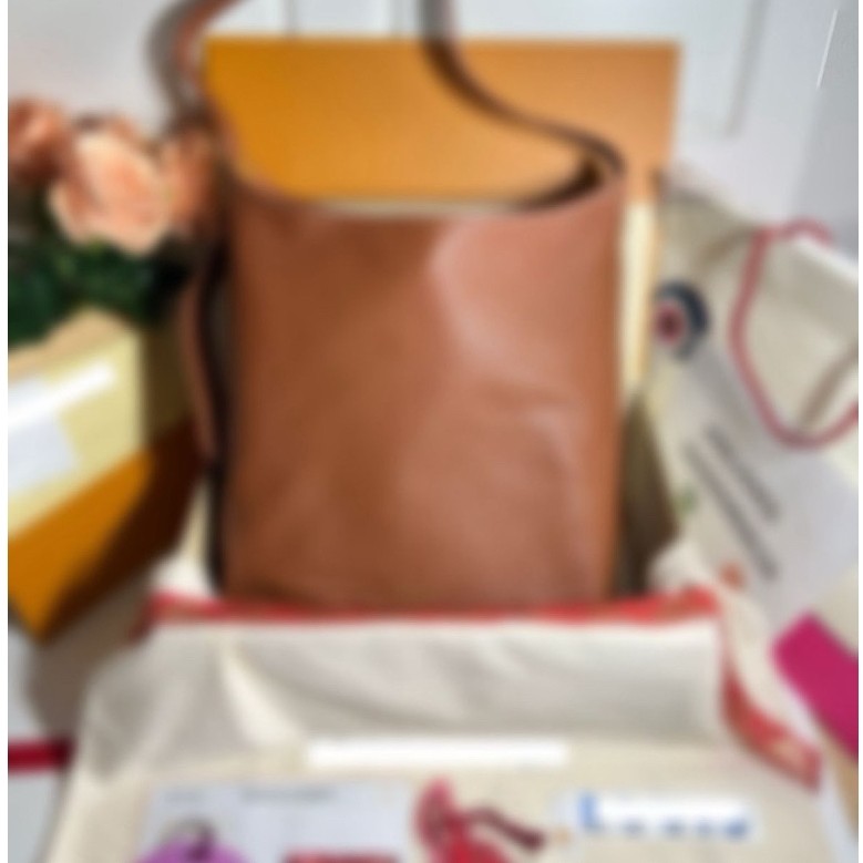 Preloved low key hobo mm cognac Authentic