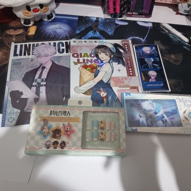 Link Click Merch artboard, postcard, press on nail set, plush