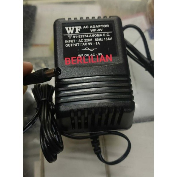 Adaptor AC 9V 1A input AC 220V Merek WF