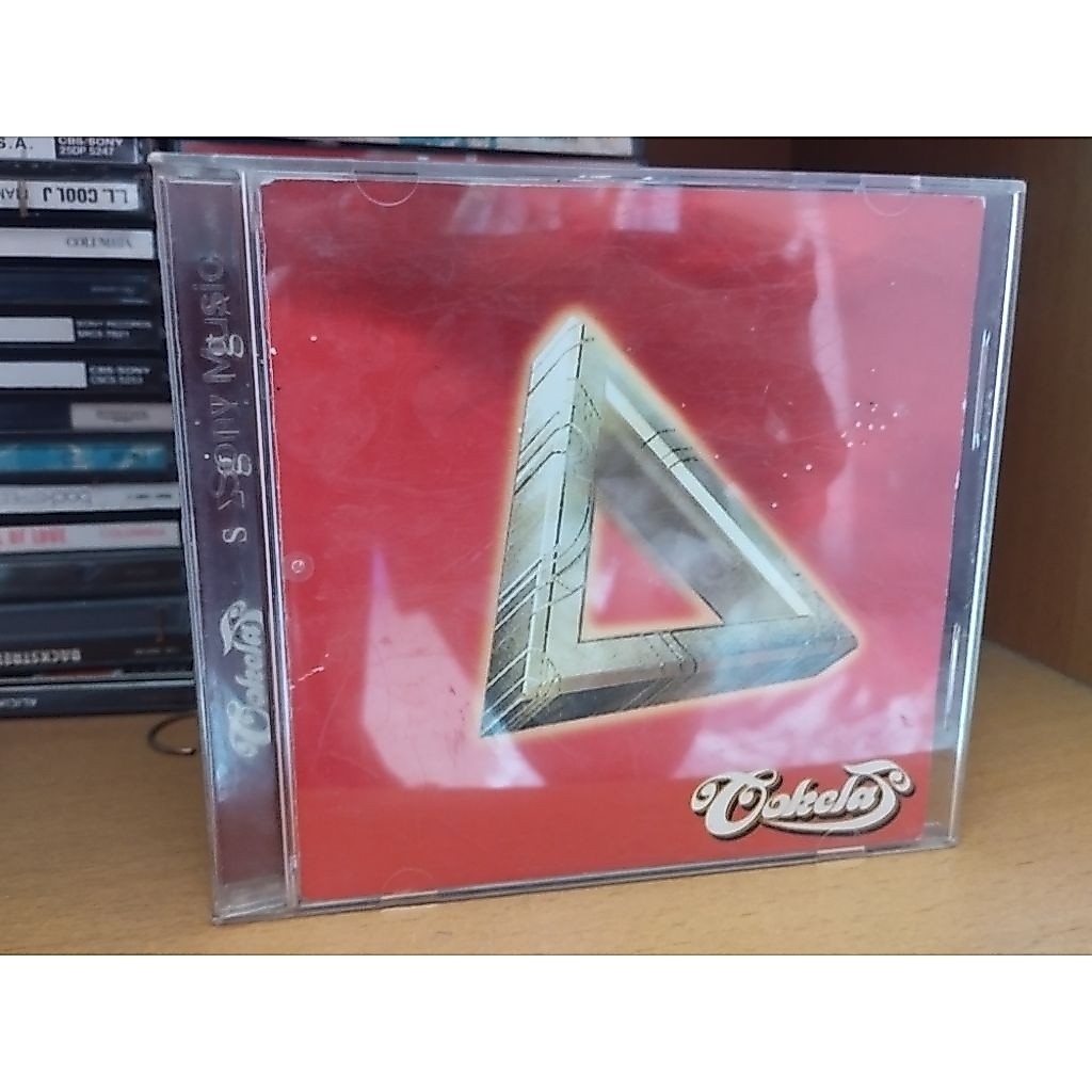 CD cokelat segitiga