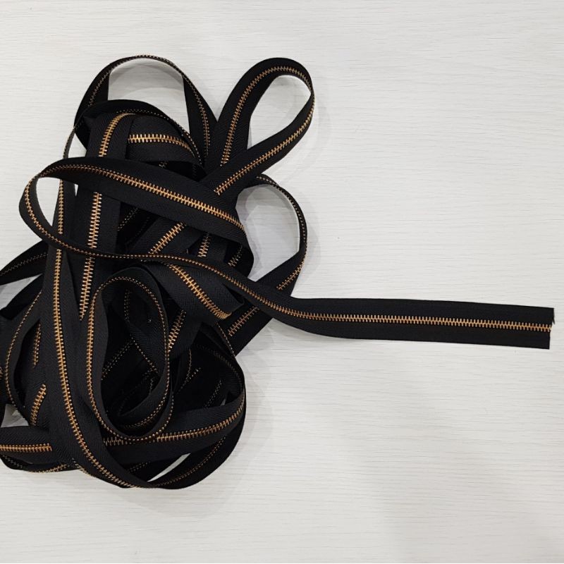 Resleting meteran YKK kuningan  (harga per 0,5m) dan Kepala resleting