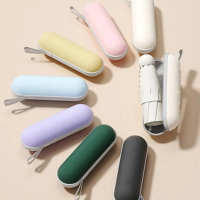 Payung Lipat Mini Kecil Genggam Sarung Tas Kotak Pouch Gantung Box Kapsul UPF50+ Anti Panas Waterproof Capsule Foldable Umbrella Anti UV Sinar Matahari Dan Hujan Cream Pink Biru Putih Wanita Kerja Ringkas Travel Walking OVAL