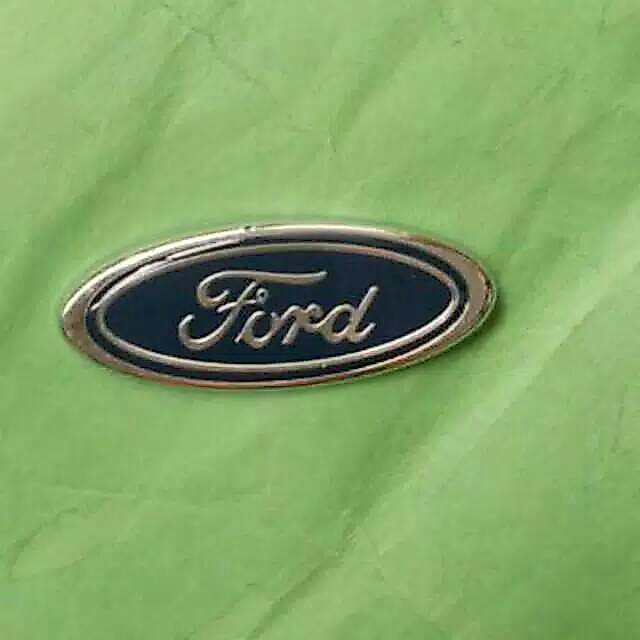 Logo emblem ford laser taxi bagian depan