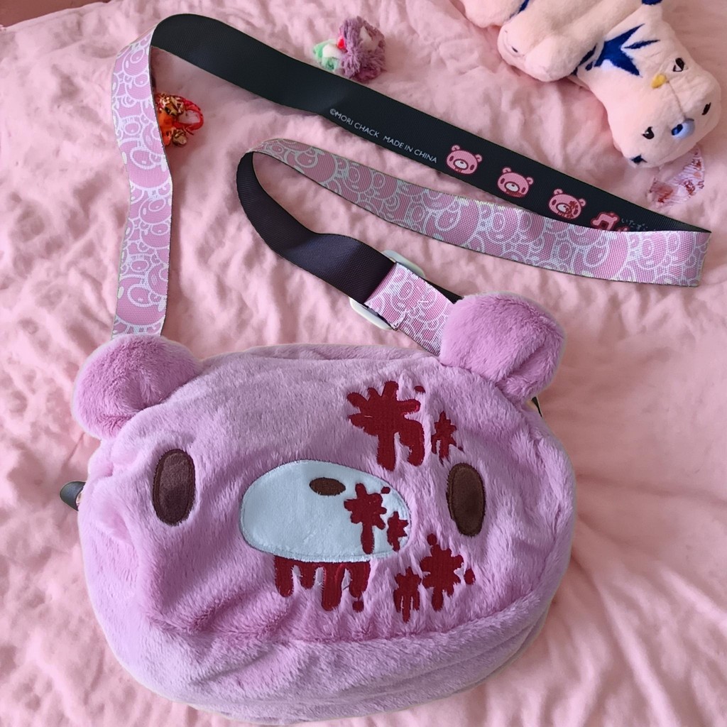 Gloomy Bear ush crossbody bag: Pink, cute - edgy with “blood - satter” details. A fun, unique pick f