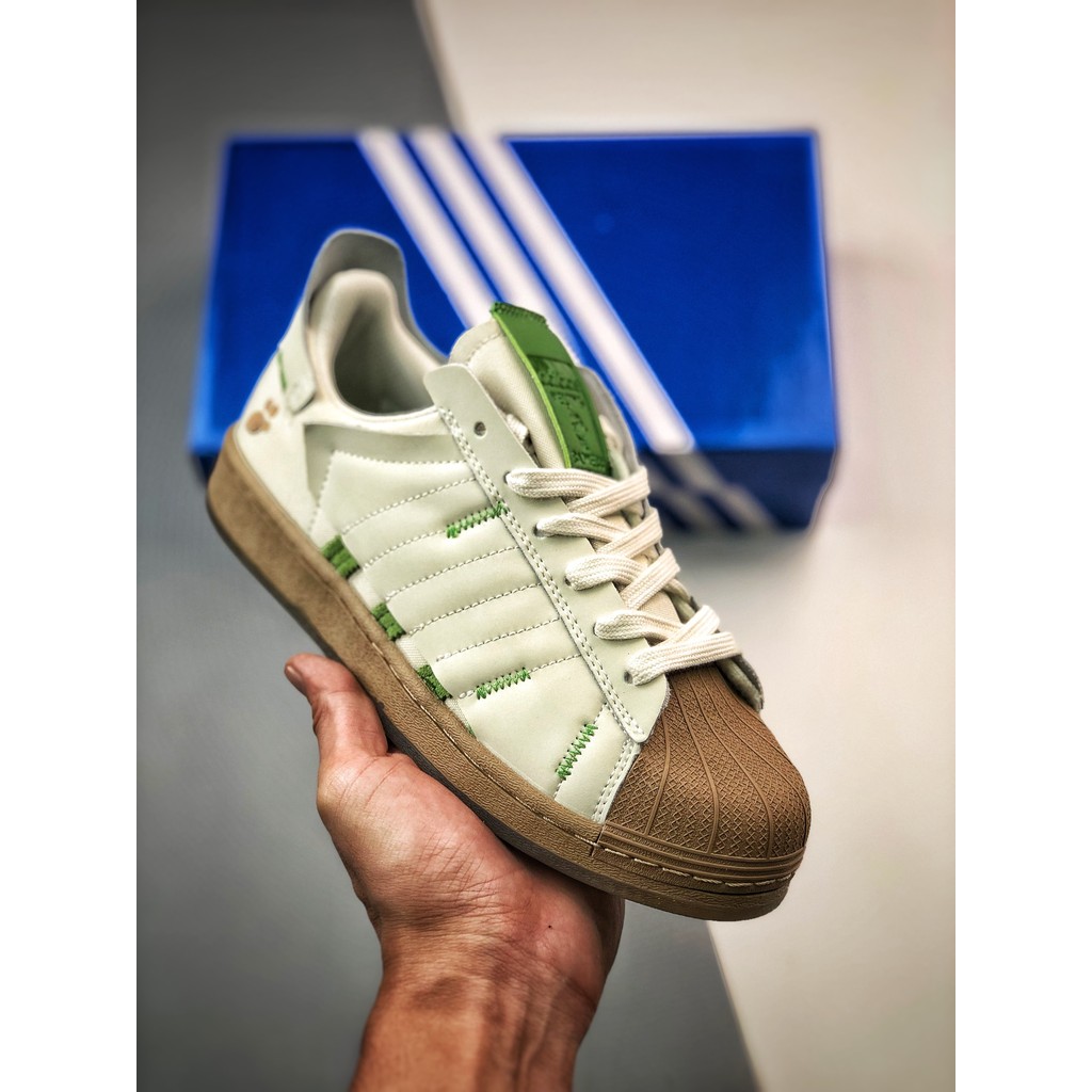 Melting Sadness 4D1D4S Originals Superatar Sepatu olahraga kasual dengan ujung cangkang berwarna put