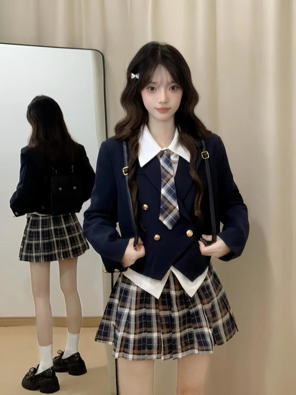 Versi Korea dari jas gaya perguruan tinggi desain wanita kemeja tidak beraturan rok lipit kotak-kota