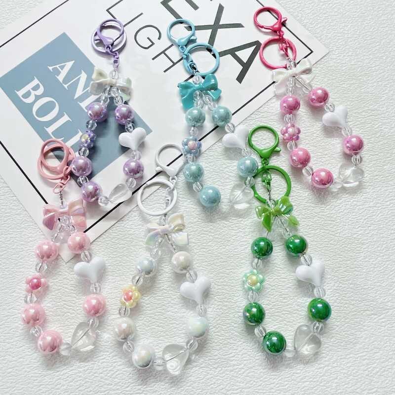 

Telepon Kecil Berbentuk Hati Warna Permen Segar dengan Manik-manik Bunga DIY Rantai Kunci Tas Pita