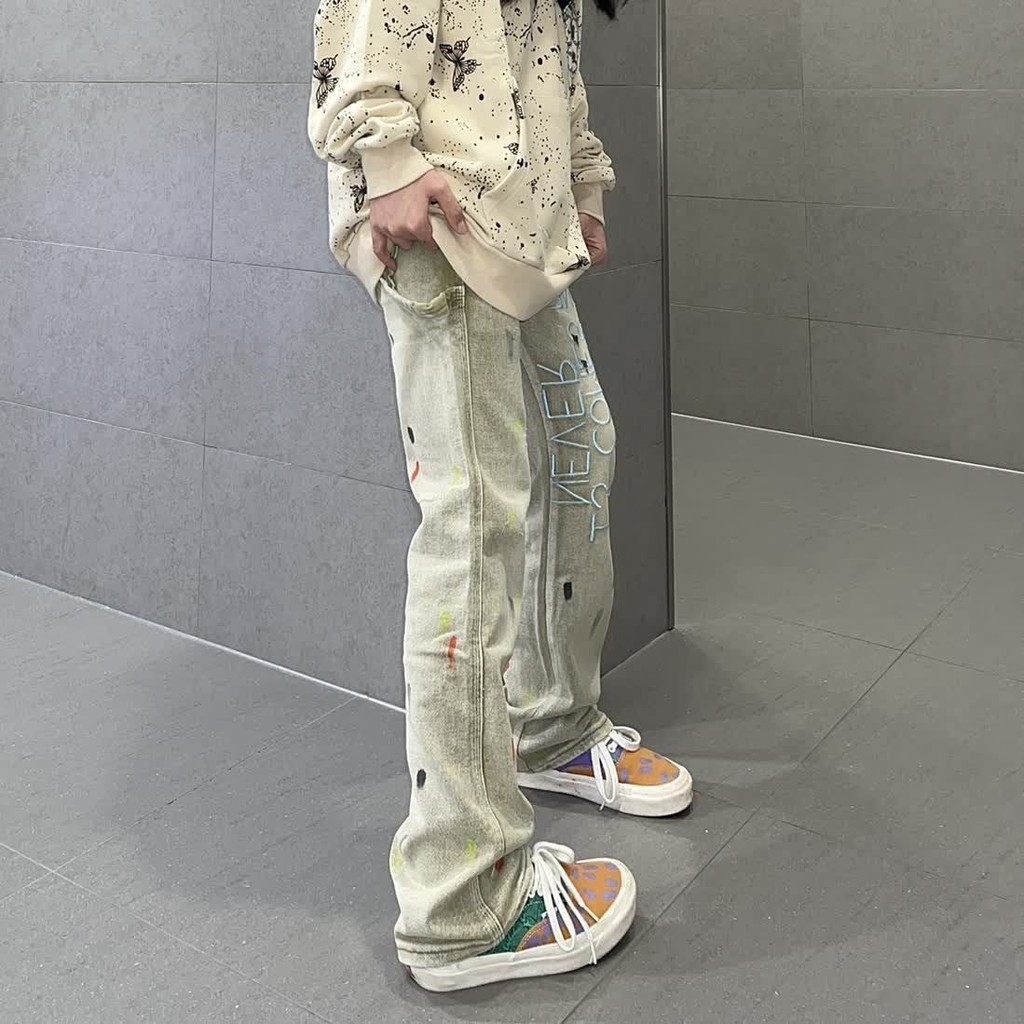 Celana jins huruf bordir kuning tertekan retro jalanan Amerika untuk pria dan wanita celana panjang 