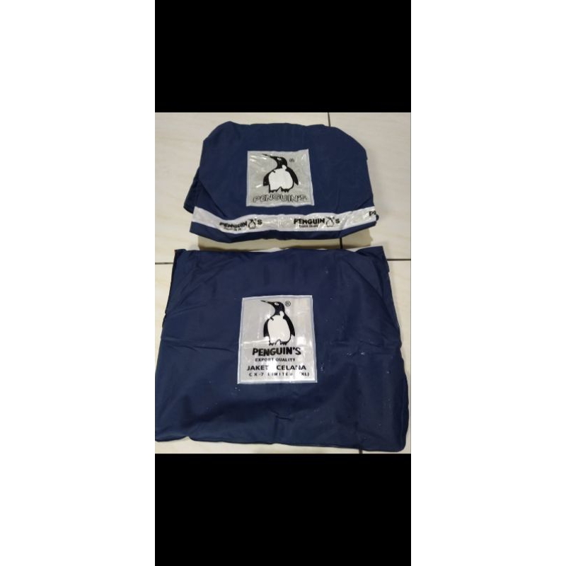 JAS HUJAN PINGUIN CX 7