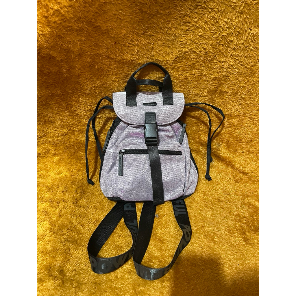 PL Tas Ransel Justice Mini Backpack Perempuan Perak Ungu Glitter kilau 26x25x10cm Nominus. Iz