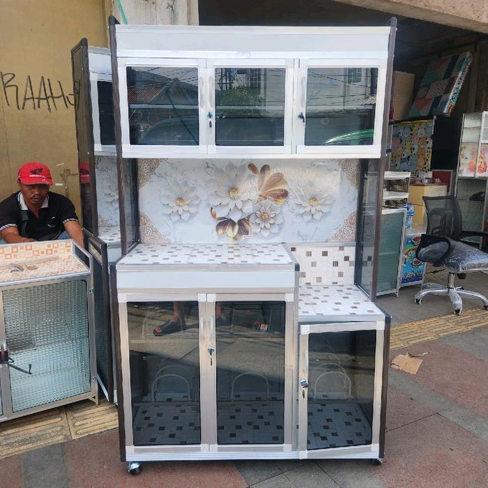 Rak Piring Alumunium Tiang Jumbo Coklat Roda Kaca Riben