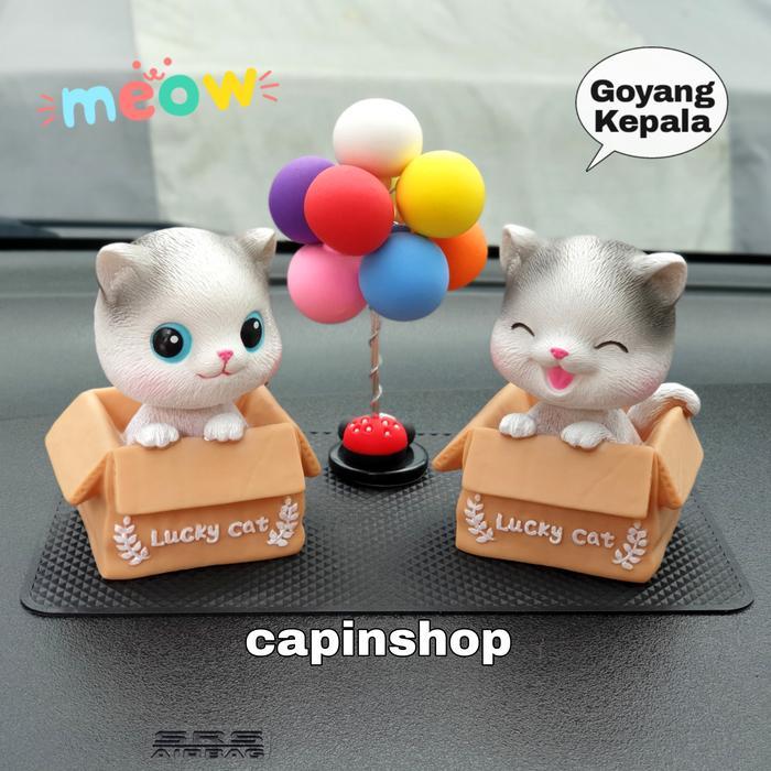 hiasan dashboard mobil kucing