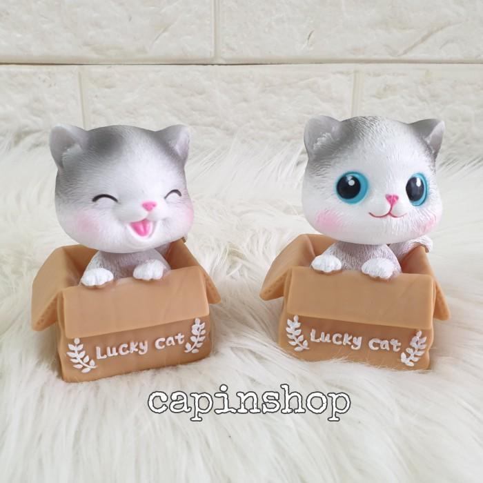 hiasan dashboard mobil kucing