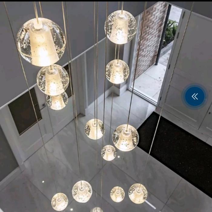 Lampu gantung kristal void tangga minimalis LED modern
