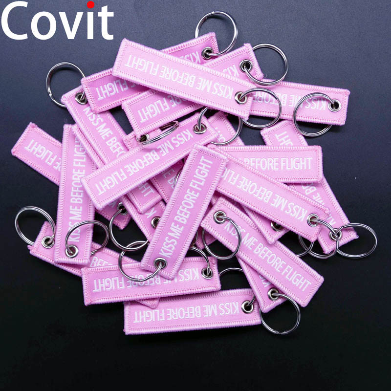 20Pcs/Lot 7.7*2cm Pilot Keychains Aviation Gift KISS ME BEFORE FLIGHT Warning Men Pendant Duplex