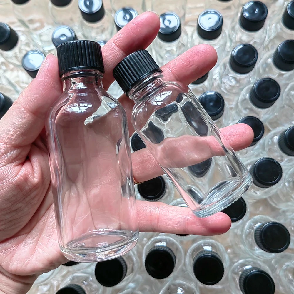 2oz Small Clear Glass Bottles with Lids for Liquids, Tiny Short Jars with Caps Mini Glass Juice Bott